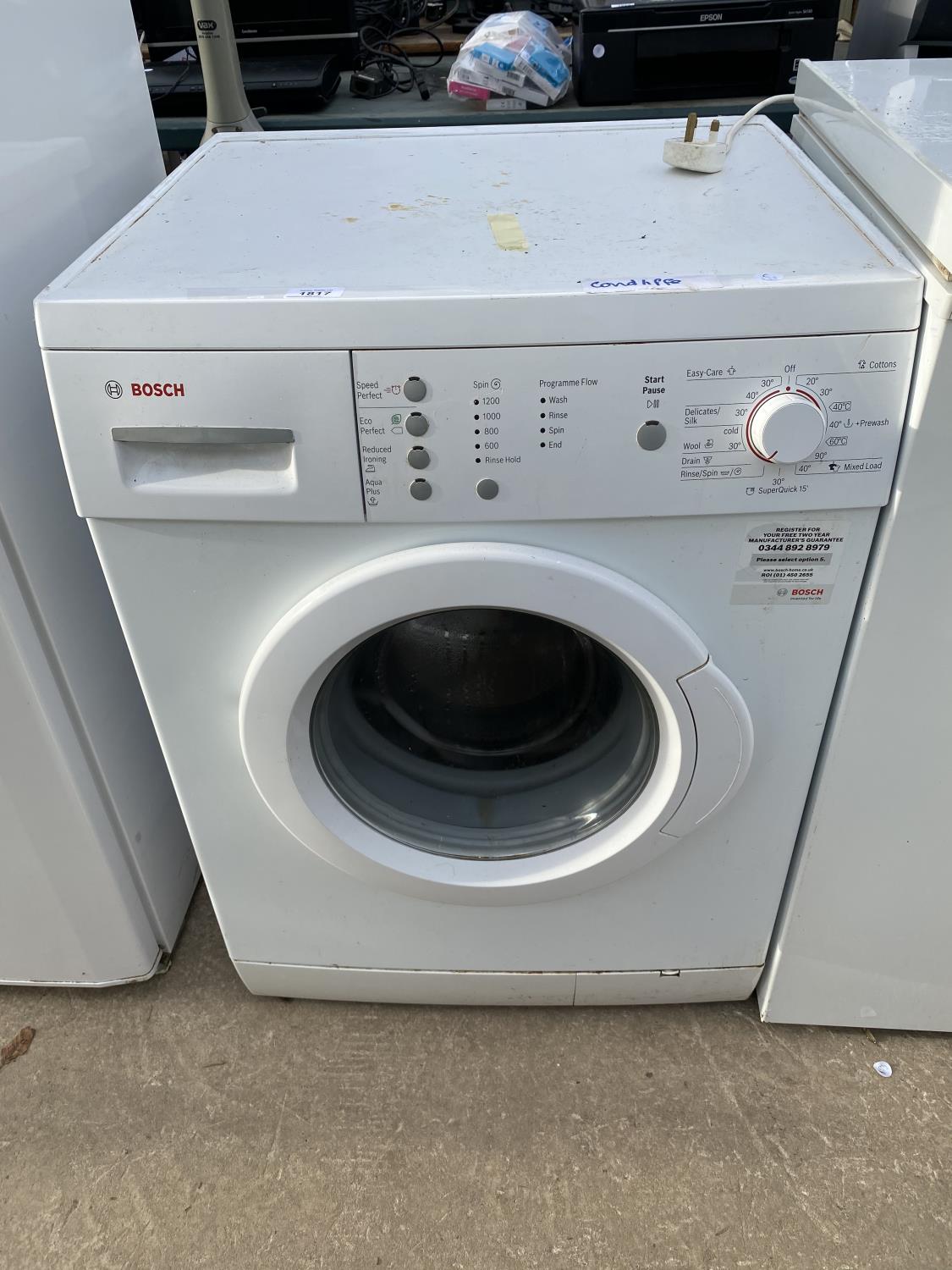 A WHITE BOSCH WASHING MACHINE BELIEVED IN WORKING ORDER BUT NO WARRANTY