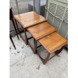 A RETRO NEST OF G PLAN STYLE TABLES