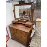 AN OAK ART NOUVEAU DRESSING CHEST OF TWO SHORT AND TWO LONG DRAWERS, THE MIRROR TOP ENCLOSING TWO