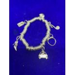A SILVER LINKS OF LONDON CHARM BRACELET WITH SIX CHARMS IN A PRESENTATION BOX