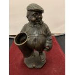 A NOVELTY BRONZE GOLFER DESK PEN HOLDER - HEIGHT - 19 CM