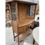 AN UNUSUAL ART NOUVEAU BOW FRONTED INLAID OAK CHIFFONIER WITH TWO LOWER DOORS AND DRAWER AND UPPER