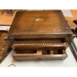 A LARGE WOODEN FLATWARE BOX WITH TWO DRAWERS AND HINGED LID WITH BRASS DETAIL