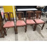 A SET OF FOUR OAK EARLY 20TH CENTURY DINING CHAIRS