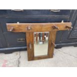 AN EARLY 20TH CENTURY OAK WALL MOUNTED MIRROR WITH FOUR COAT HOOKS, 49x44x22"