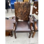 A LEATHER AND COWHIDE ARMCHAIR