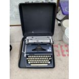 AN ADLER GABRIELE 35 TYPE WRITER IN A CASE