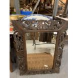 A LARGE WOODEN CARVED FRAMED MIRROR 90CM X 66CM