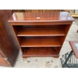 A MAHOGANY AND CROSSBANDED OPEN THREE TEIR BOOKCASE