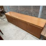 A RETRO JENTIQUE TEAK SIDEBAORD ENCLOSING THREE DRAWERS AND THREE CUPBOARDS