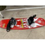 A FREE MOTION XLR8 SNOW BOARD WITH BINDINGS