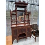 A LATE VICTORIAN MAHOGANY MIRROR BACK CHIFFONIER WITH TURNED UPRIGHTS AND CARVING TO THE BASE