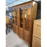 TWO PINE CABINETS EACH WITH TWO LOWER DOORS AND TWO UPPER GLAZED DOORS