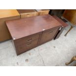 AN INLAID MAHOGANY MAGAZINE RACK TABLE AND A MAHOGANY EFFECT CABINET WITH ONE DOOR AND TWO DRAWERS