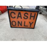 AN ILLUMINATED 'CASH ONLY' SIGN