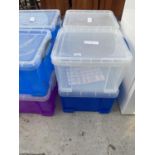 FOUR STACKABLE PLASTIC STORAGE BOXES WITH LIDS