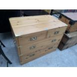 A PINE CAMPAIGN STYLE CHEST OF TWO SHORT AND TWO LONG DRAWERS WITH BRASS CORNER PROTECTORS, SIDE