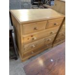 A PINE CHEST OF TWO SHORT AND THREE LONG DRAWERS