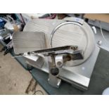 AN INDUSTRIAL ELECTRIC MEAT SLICER BELIEVED IN WORKING ORDER BUT NO WARRANTY