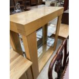 A MODERN OAK OPEN DISPLAY CABINET WITH GLASS SHELVES AND SECRET DRAWER TO THE TOP, 43" WIDE