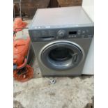 A SILVER HOTPOINT 9KG WASHING MACHINE BELIEVED IN WORKING ORDER BUT NO WARRANTY