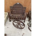 A VINTAGE FIRE GRATE TO INCLUDE A VINTAGE CAST WHEEL