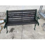 A GARDEN BENCH WITH CAST IRON ENDS