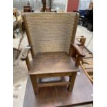 A 19TH CENTURY STYLE CHILDS ORKNEY CHAIR WITH CURVED SEAGRASS BACK, SHAPED ARMS AND SOLID SEAT