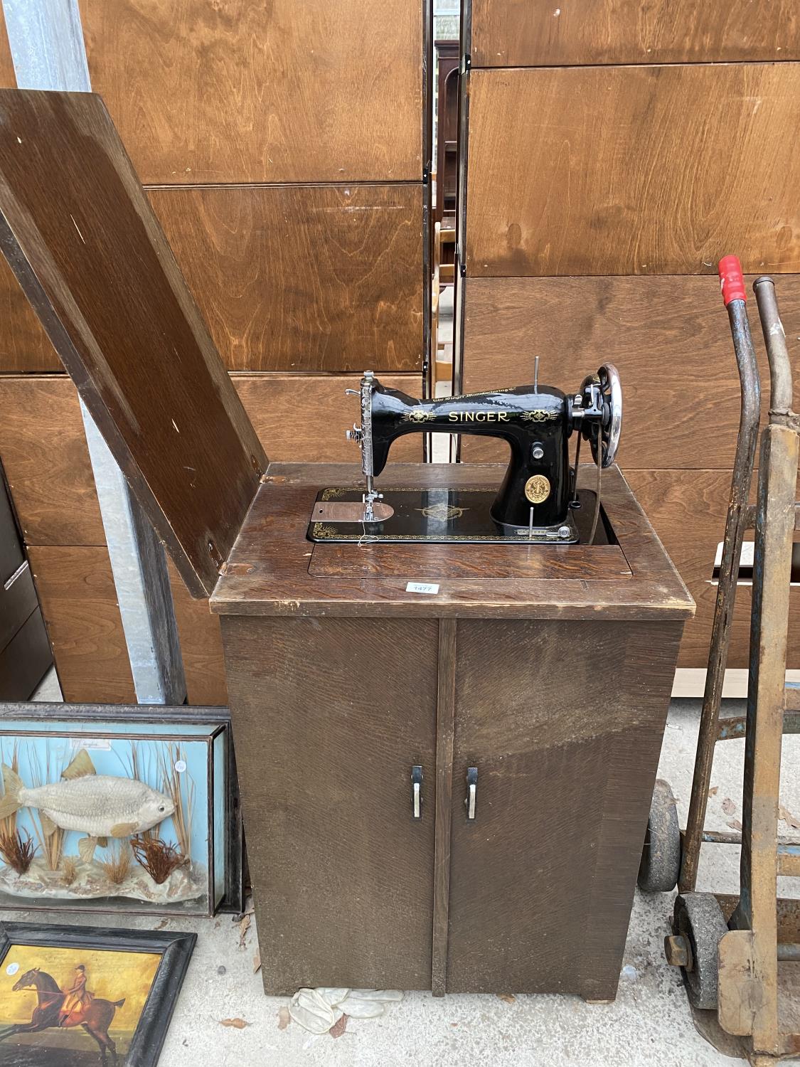 A VINTAGE SINGER SEWING MACHINE COMPLETE WITH CASE AND ORIGINAL FOOT PEDDLE AND INSTRUCTION MANUAL
