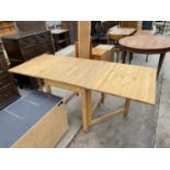 A MODERN PINE DROP-LEAF DINING TABLE, 30x73"