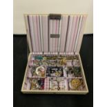 A STACKERS JEWELLERY BOX CONTAINING A SELECTION OF COSTUME JEWELLERY