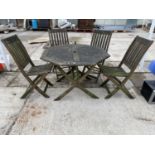 AN OCTAGONAL HARDWOOD GARDEN TABLE AND FOUR CHAIRS