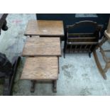 A NEST OF THREE OAK TABLES AND MAGAZINE RACK