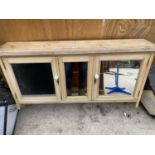 A VINTAGE PINE MIRRORED WALL UNIT