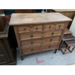 AN OAK CHEST OF TWO SHORT AND THREE LONG DRAWERS