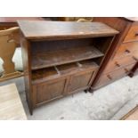 AN EARLY 20TH CENTURY OAK TWO TIER OPEN BOOKCASE WITH CUPBOARD TO BASE, 37" WIDE
