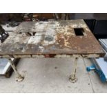 A LARGE VINTAGE CAST IRON INDUSTRIAL WORK TABLE