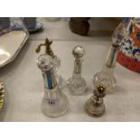 A SILVER BELL INDISTINCT HALLMARK IN THE FORM OF A THISTLE AND FOUR GLASS PERFUME BOTTLES WITH