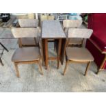 A RETRO MELAMINE TOPPED DROP LEAF DINING TABLE AND FOUR CHAIRS