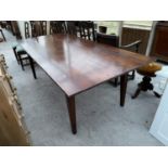 AN OAK REFECTORY TABLE ON TAPERED SUPPORTS