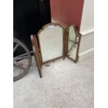 A DECORATIVE WOODEN FRAMED DRESSING TABLE MIRROR