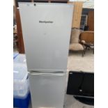 A WHITE MONTPELLIER UPRIGHT FRIDGE FREEZER BELIEVED IN WORKING ORDER BUT NO WARRANTY