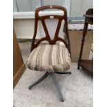 A 1970'S SWIVEL OFFICE CHAIR WITH UPHOLSTERED SEAT, METALWARE BASE AND CLEAR BROWN ACRYLIC BACK