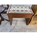 AN OAK DRESSING STOOL WITH HINGED SEAT