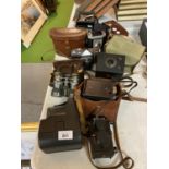 A QUANTITY OF VINTAGE CAMERAS AND CASES