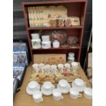 A LARGE COLLECTION OF KITCHEN ITEMS TO INCLUDE CUPS AND SAUCERS, PLACE MATS AND MUGS ETC