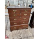 A VICTORIAN MAHOGANY CHEST OF TWO SHORT AND FOUR LONG DRAWERS WITH ELABORATE BRASS HANDLES