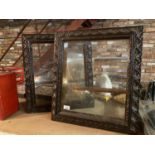 A PAIR OF HEAVILY CARVED OAK AND MAHOGANY GLASS FRONTED WALL CUPBOARDS (ONE GLASS DOOR A/F) - HEIGHT