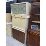 A RETRO KITCHEN CABINET WITH FALL FRONT, TWO LOWER AND TWO UPPER DOORS AND TWO DRAWERS