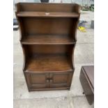 AN ERCOL WATERFALL BOOKCASE